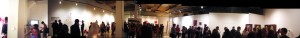A panoramic view of the entire gallery. In the full view, I'm the one standing in the center wearing a hat and a tie and a blank look of disbelief.  Courtesy Jesse Clark Studios.