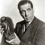 Humphrey Bogart holding the Maltese Falcon (film prop).