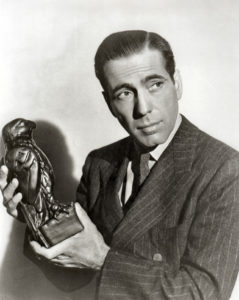 Humphrey Bogart holding the Maltese Falcon (film prop).