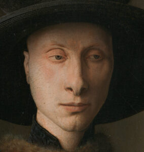 Close-up of man's face from "The Arnolfini Portrait" by Jan van Eyck