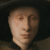 Close-up of man's face from "The Arnolfini Portrait" by Jan van Eyck