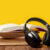 Photo of headphones atop an open book