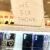 "We fix phone" sign atop a seller's case of smartphone covers.